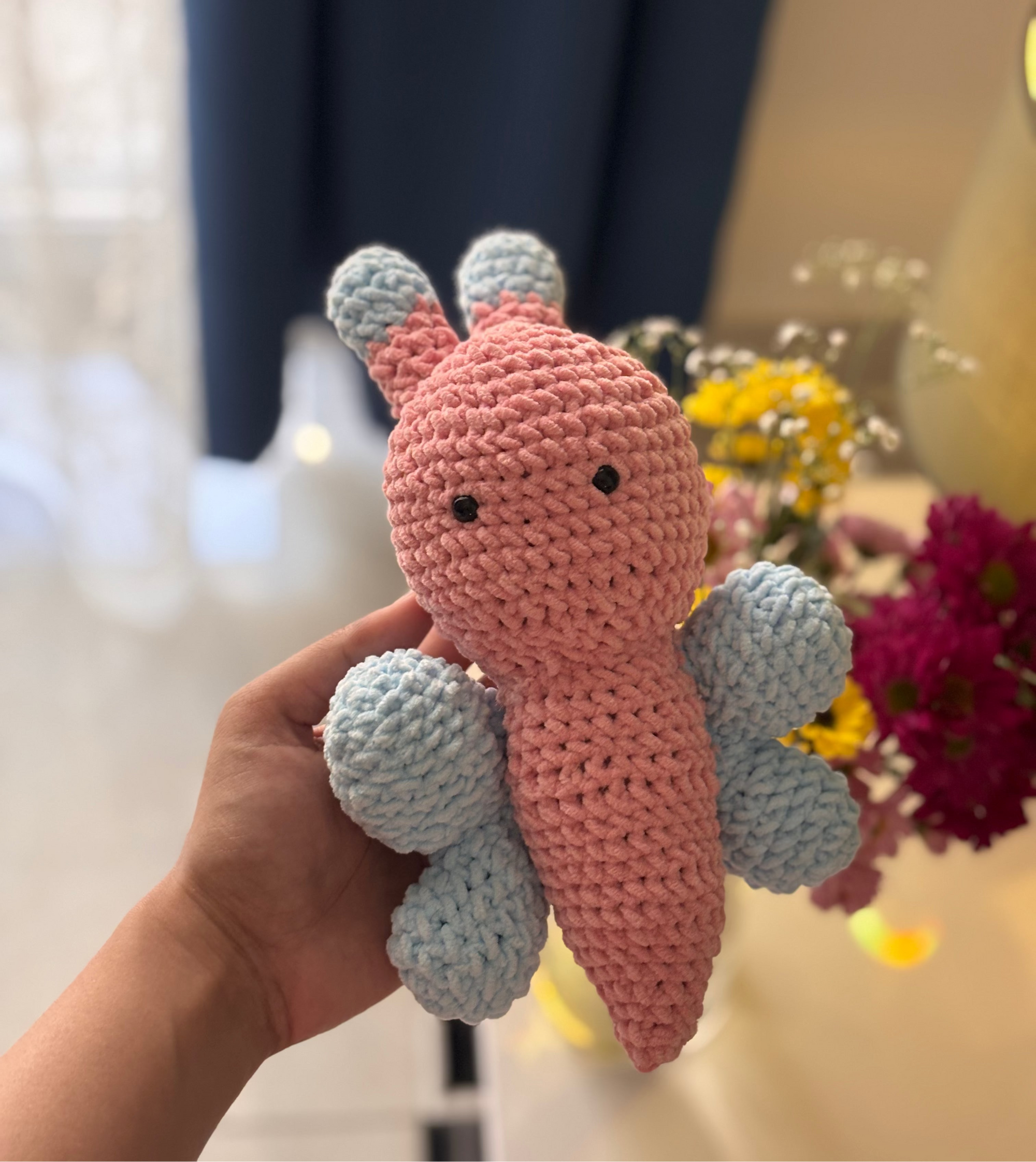 handmade crochet butterfly plushie in pink and blue, soft amigurumi toy with small wings and antennae