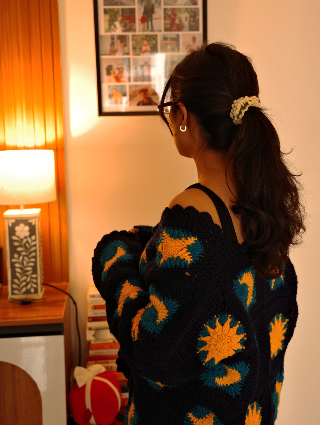 crochet granny square cardigan, with dark blue and golden yellow granny square pattern