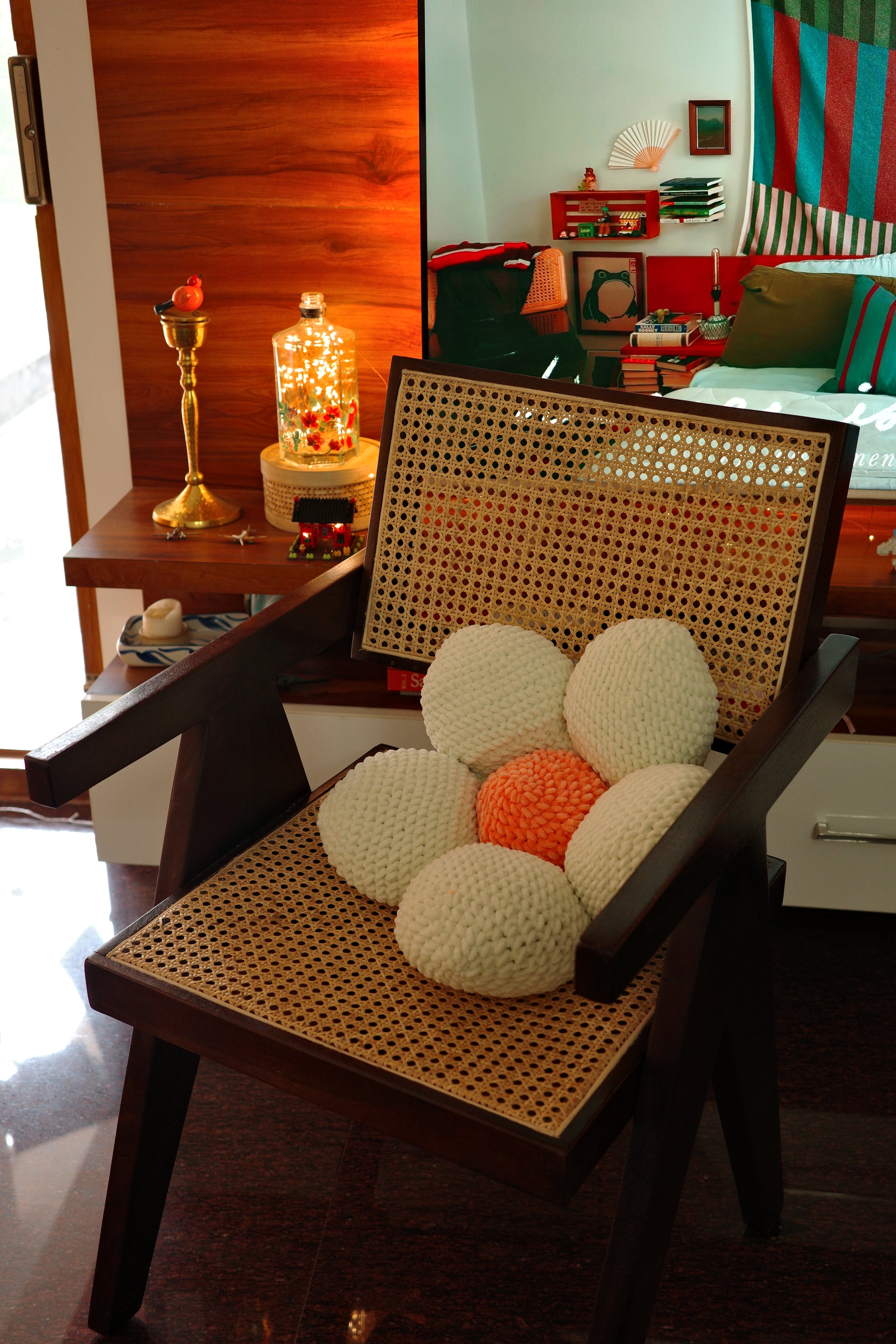 Decorative crochet flower-shaped object on a chair with a blurred background